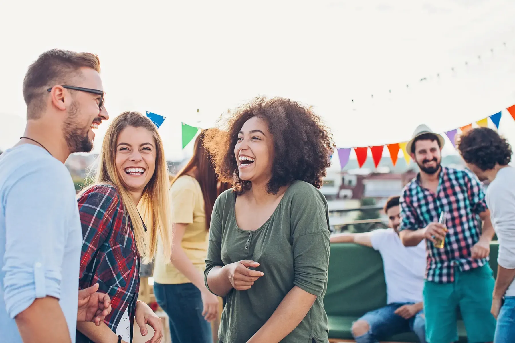 Friends hanging out and laughing at a barbecue